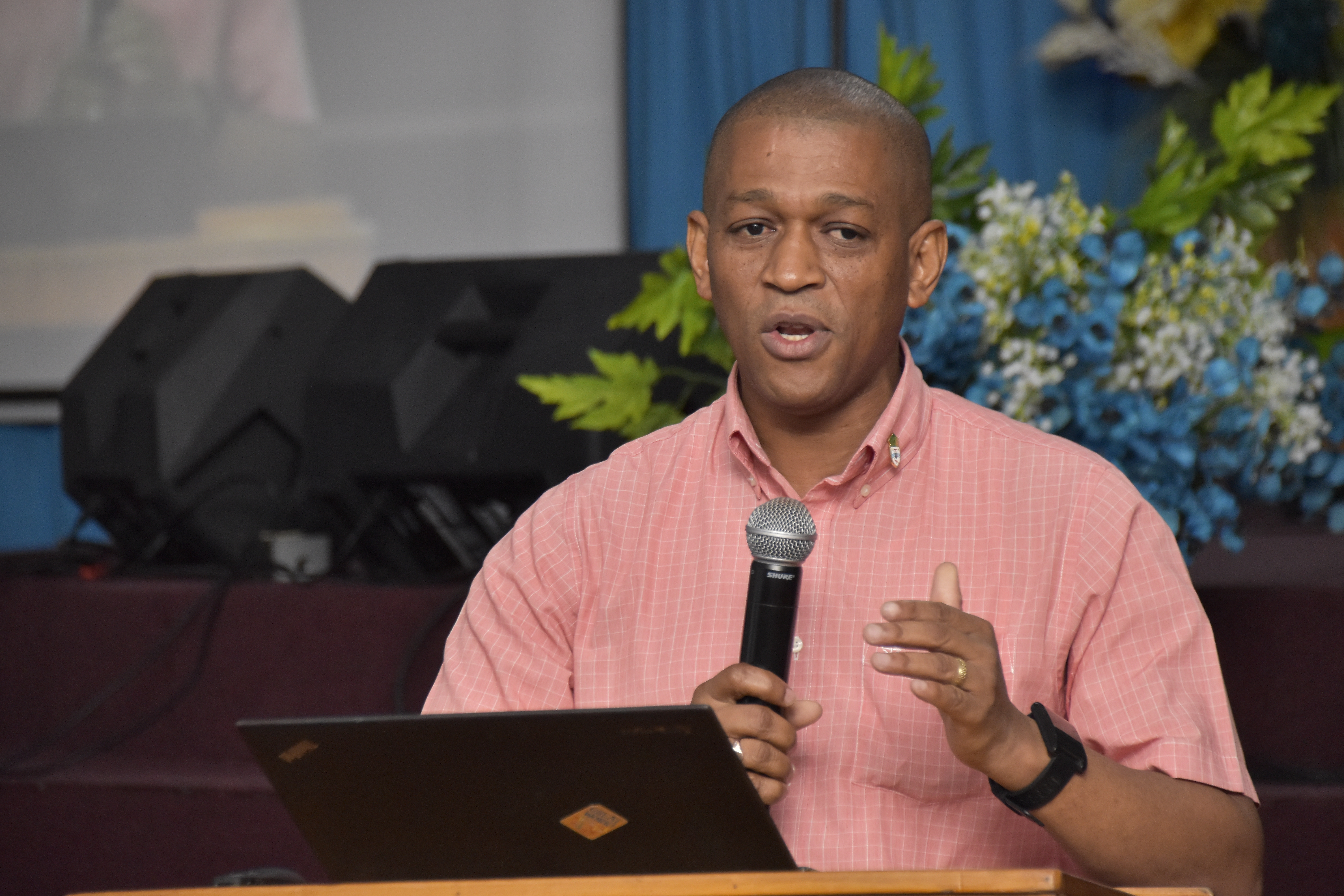 Director, Department of Energy, Dr. Mark Bynoe, gestures as he makes a point during his presentation at the Vreed-en-Hoop Wesleyan Church.