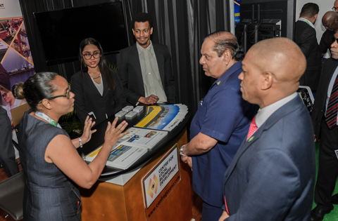 Prime Minister Moses Nagamootoo and other officials tour the many booths at the exhibition (Delano Williams photo)